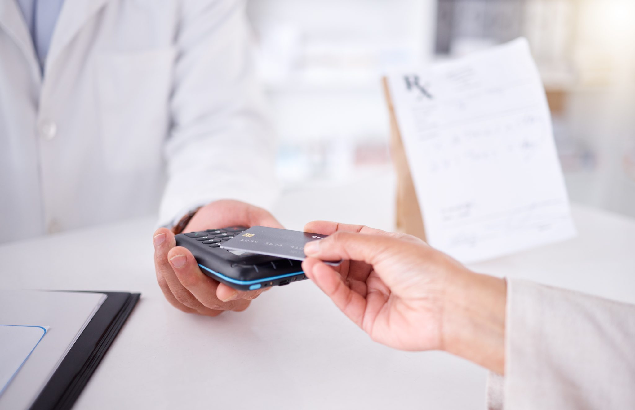 Pharmacist taking card for medication