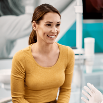 Woman discussing care plan at chiropractor